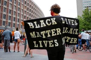 A Black Lives Matter (BLM) protester in Boston, Massachusetts (REUTERS/Brian Snyder) A Black Lives Matter (BLM) protester in Boston, Massachusetts (REUTERS/Brian Snyder)