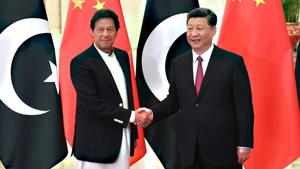 China's President Xi Jinping (R) shakes hands with Pakistan's Prime Minister Imran Khan before a meeting at the Great Hall of the People in Beijing on April 28 last year.(AFP/File) China's President Xi Jinping (R) shakes hands with Pakistan's Prime Minister Imran Khan before a meeting at the Great Hall of the People in Beijing on April 28 last year.(AFP/File)