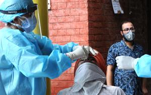 Patiala, India-September 10, 2020::: A medic collects a sample for COVID-19 test from a swab collection booth testing at CHC Model town in Patiala on Thursday, September 10, 2020.Photo by Bharat Bhushan Hindustan Times. Patiala, India-September 10, 2020::: A medic collects a sample for COVID-19 test from a swab collection booth testing at CHC Model town in Patiala on Thursday, September 10, 2020.Photo by Bharat Bhushan Hindustan Times.