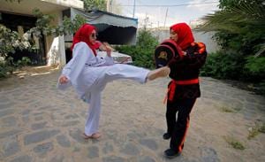 Martial arts trainer Seham Amer practices self-defense moves with a trainee at a house in Sanaa, Yemen September 5, 2020.(REUTERS) Martial arts trainer Seham Amer practices self-defense moves with a trainee at a house in Sanaa, Yemen September 5, 2020.(REUTERS)