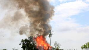 In this file photo taken on September 7, 2017, a house burns in Gawdu Tharya village near Maungdaw in Rakhine state in northern Myanmar.(AFP) In this file photo taken on September 7, 2017, a house burns in Gawdu Tharya village near Maungdaw in Rakhine state in northern Myanmar.(AFP)