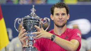 Dominic Thiem, of Austria, holds up the championship trophy after defeating Alexander Zverev, of Germany, in the men's singles final of the US Open tennis championships.(AP) Dominic Thiem, of Austria, holds up the championship trophy after defeating Alexander Zverev, of Germany, in the men's singles final of the US Open tennis championships.(AP)