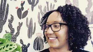 This 2020 photo provided by Tanisha Williams shows her in Lewisburg, Pa. Williams, a botanist at Bucknell University, knows exactly which plants she's looking for. But after being questioned by strangers in public parks, Williams, who is Black, has started carrying her field guides with her. “I've been quizzed by random strangers,” she said. “Now I bring my wildflower books and botanical field guides, trying to look like a scientist. It’s for other people. I wouldn’t otherwise lug these books.”(AP) This 2020 photo provided by Tanisha Williams shows her in Lewisburg, Pa. Williams, a botanist at Bucknell University, knows exactly which plants she's looking for. But after being questioned by strangers in public parks, Williams, who is Black, has started carrying her field guides with her. “I've been quizzed by random strangers,” she said. “Now I bring my wildflower books and botanical field guides, trying to look like a scientist. It’s for other people. I wouldn’t otherwise lug these books.”(AP)