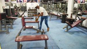 Staff cleaning and sanitising equipment and premises of a gym.(Representational Photo/HT) Staff cleaning and sanitising equipment and premises of a gym.(Representational Photo/HT)