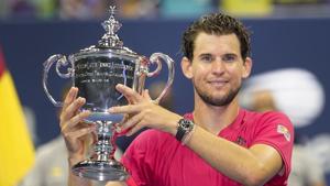New York: Dominic Thiem, of Austria, holds up the championship trophy after defeating Alexander Zverev, of Germany, in the men's singles final of the US Open tennis championships, Sunday, Sept. 13, 2020, in New York.AP/PTI(AP14-09-2020_000010A)(AP) New York: Dominic Thiem, of Austria, holds up the championship trophy after defeating Alexander Zverev, of Germany, in the men's singles final of the US Open tennis championships, Sunday, Sept. 13, 2020, in New York.AP/PTI(AP14-09-2020_000010A)(AP)