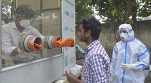 A health worker collects swab sample for coronavirus test in Ghaziabad on Tuesday.(Sakib Ali/HT Photo) A health worker collects swab sample for coronavirus test in Ghaziabad on Tuesday.(Sakib Ali/HT Photo)
