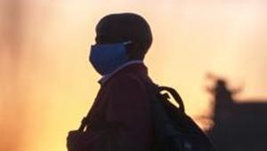 A man wearing protective masks to help curb the spread of the coronavirus(AP) A man wearing protective masks to help curb the spread of the coronavirus(AP)