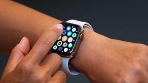 A customer checks Apple's new Apple Watch Series 4 after it went on sale at the Apple Store in Tokyo's Omotesando shopping district in Japan.(Reuters Photo) A customer checks Apple's new Apple Watch Series 4 after it went on sale at the Apple Store in Tokyo's Omotesando shopping district in Japan.(Reuters Photo)