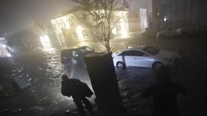 People use flashlights as they walk on flooded streets in search of their vehicle, Wednesday, Sept. 16, 2020, in Pensacola, Fla. Hurricane Sally made landfall Wednesday near Gulf Shores, Alabama,.(AP File Photo) People use flashlights as they walk on flooded streets in search of their vehicle, Wednesday, Sept. 16, 2020, in Pensacola, Fla. Hurricane Sally made landfall Wednesday near Gulf Shores, Alabama,.(AP File Photo)