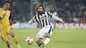 FILE - In this Dec. 9, 2014 file photo, Juventus' Andrea Pirlo, right, challenges the ball with Atletico' Mario Mandzukic during a Champions League, Group A, soccer match between Juventus and Atletico de Madrid at the Juventus stadium in Turin, Italy. New Juventus coach Andrea Pirlo had his coaching qualification rubber-stamped by the Italian soccer federation on Wednesday, Sept. 16, 2020.(AP) FILE - In this Dec. 9, 2014 file photo, Juventus' Andrea Pirlo, right, challenges the ball with Atletico' Mario Mandzukic during a Champions League, Group A, soccer match between Juventus and Atletico de Madrid at the Juventus stadium in Turin, Italy. New Juventus coach Andrea Pirlo had his coaching qualification rubber-stamped by the Italian soccer federation on Wednesday, Sept. 16, 2020.(AP)