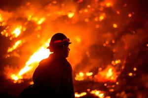 TOPSHOT - A firefighter watches the Bobcat Fire burning on hillsides near Monrovia Canyon Park in Monrovia, California on September 15, 2020. - A major fire that has been raging outside Los Angeles for more than a week threatened to engulf a historic observatory and billion-dollar broadcast towers on September 15 as firefighters struggled to contain the flames. The so-called Bobcat Fire was within 500 feet (150 meters) from the 116-year-old Mt. Wilson Observatory, the US Forest Service said in a tweet, while fire officials said crews were in place "ready to receive the fire." (Representational)(AFP) TOPSHOT - A firefighter watches the Bobcat Fire burning on hillsides near Monrovia Canyon Park in Monrovia, California on September 15, 2020. - A major fire that has been raging outside Los Angeles for more than a week threatened to engulf a historic observatory and billion-dollar broadcast towers on September 15 as firefighters struggled to contain the flames. The so-called Bobcat Fire was within 500 feet (150 meters) from the 116-year-old Mt. Wilson Observatory, the US Forest Service said in a tweet, while fire officials said crews were in place "ready to receive the fire." (Representational)(AFP)