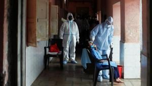 File photo: A health worker in personal protective equipment (PPE) collects a swab sample of a child.(REUTERS) File photo: A health worker in personal protective equipment (PPE) collects a swab sample of a child.(REUTERS)