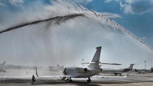 A private jet being accorded a water salute during the inauguration of general aviation terminal at IGI Airport in New Delhi on Thursday.(PTI Photo) A private jet being accorded a water salute during the inauguration of general aviation terminal at IGI Airport in New Delhi on Thursday.(PTI Photo)