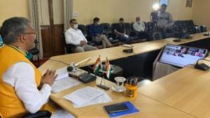 Chief minister TS Rawat addressing a press conference virtually in Dehradun on Friday. He said the Mahakumbh would be held on schedule next year, but in a restricted manner.(Sourced) Chief minister TS Rawat addressing a press conference virtually in Dehradun on Friday. He said the Mahakumbh would be held on schedule next year, but in a restricted manner.(Sourced)