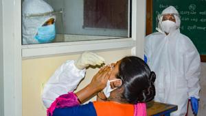 A medic collects samples for rapid antigent test, in Karad, Maharashtra, on September 8.(PTI)