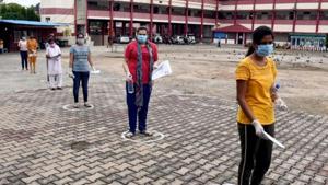 Students waiting outside an exam centre for appearing in an entrance exam(ANI) Students waiting outside an exam centre for appearing in an entrance exam(ANI)