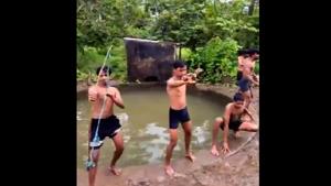 The reverse video shows the men coming out of a small waterbody, one by one.(Twitter) The reverse video shows the men coming out of a small waterbody, one by one.(Twitter)