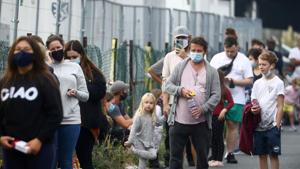 People queue at a test centre following an outbreak of the coronavirus disease in Southend-on-sea, Britain.(REUTERS) People queue at a test centre following an outbreak of the coronavirus disease in Southend-on-sea, Britain.(REUTERS)