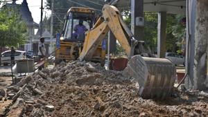 MC demolishing pavements at the Sarabha Nagar market in Ludhiana on Sunday.(Harsimar Pal Singh/HT)