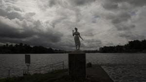 Rain clouds are seen behind a statue on the banks of the Periyar river in Kochi in Kerala.(AP PHOTO.) Rain clouds are seen behind a statue on the banks of the Periyar river in Kochi in Kerala.(AP PHOTO.)