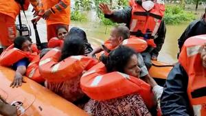 NDRF team along with local youths conducting rescue operations in low lying areas where people stuck in waterlogged places following heavy rainfall in the region, in Udupi on Sunday.(ANI photo) NDRF team along with local youths conducting rescue operations in low lying areas where people stuck in waterlogged places following heavy rainfall in the region, in Udupi on Sunday.(ANI photo)