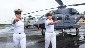 Sub Lt. Riti Singh and Sub Lt. Kumudini Tyagi, the first women airborne tacticians who will operate from deck of warships, after they passed out of Indian Navy’s Observer Course, at Southern Naval Command, Kochi(PTI Photo)