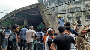 A child was pulled alive by the National Disaster Response Force (NDRF), which is carrying out rescue efforts.(Praful Gangurde/ HT photo) A child was pulled alive by the National Disaster Response Force (NDRF), which is carrying out rescue efforts.(Praful Gangurde/ HT photo)