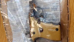 A handout photograph released by the Metropolitan Police in London on Monday shows a yellow-handed Llama pistol, which featured in James Bond 007 movie Die Another Day, which has been recovered by police following a burglary in London. Other guns stolen in the heist are still to be found.(AFP) A handout photograph released by the Metropolitan Police in London on Monday shows a yellow-handed Llama pistol, which featured in James Bond 007 movie Die Another Day, which has been recovered by police following a burglary in London. Other guns stolen in the heist are still to be found.(AFP)