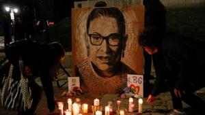 The late US Supreme Court Justice Ruth Bader Ginsburg is mourned during a vigil in Monument Square in Portland, Maine.(REUTERS) The late US Supreme Court Justice Ruth Bader Ginsburg is mourned during a vigil in Monument Square in Portland, Maine.(REUTERS)