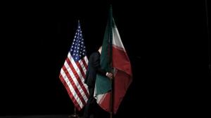 A staff member removes the Iranian flag from the stage after Iran nuclear talks at the Vienna International Center in Vienna, Austria on July 14, 2015.(Reuters file) A staff member removes the Iranian flag from the stage after Iran nuclear talks at the Vienna International Center in Vienna, Austria on July 14, 2015.(Reuters file)