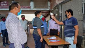 ASI Superintending Archaeologist Basant Kumar Swarnkar undergoes thermal screening at the VIP Gate ahead of the reopening of Taj Mahal.(PTI) ASI Superintending Archaeologist Basant Kumar Swarnkar undergoes thermal screening at the VIP Gate ahead of the reopening of Taj Mahal.(PTI)