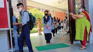 Masks, social distancing, sanitisers and videography — all precautions in place as students return to a government school in Sector 45, Chandigarh, on Monday.(Keshav Singh/HT)