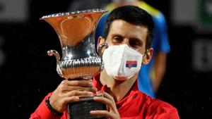 Serbia's Novak Djokovic celebrates with the trophy after winning the final against Argentina's Diego Schwartzman.(Pool via REUTERS) Serbia's Novak Djokovic celebrates with the trophy after winning the final against Argentina's Diego Schwartzman.(Pool via REUTERS)