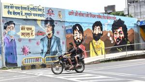 Bike rider flouts mandatory mask precaution as he rides past a painted wall with coronavirus messages at Kalbhornagar, Chinchwad in Pune on September 20, 2020. Series of decisions by the Maharashtra government in its fight against Covid-19 pandemic has upset the doctors, who are now blaming those is power responsible for deteriorating health situation in the state.(HT PHOTO) Bike rider flouts mandatory mask precaution as he rides past a painted wall with coronavirus messages at Kalbhornagar, Chinchwad in Pune on September 20, 2020. Series of decisions by the Maharashtra government in its fight against Covid-19 pandemic has upset the doctors, who are now blaming those is power responsible for deteriorating health situation in the state.(HT PHOTO)