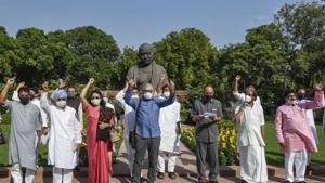 Opposition MPs staging a protest at Parliament on Sunday, after two farm bills were passed in the Rajya Sabha.(PTI) Opposition MPs staging a protest at Parliament on Sunday, after two farm bills were passed in the Rajya Sabha.(PTI)