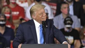 US President Donald Trump stood on a podium in front of a blue background emblazoned with “America First Healthcare Plan”.(AP Photo) US President Donald Trump stood on a podium in front of a blue background emblazoned with “America First Healthcare Plan”.(AP Photo)