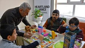 Children with special needs attend a class at the Fakhri Dabbagh Centre in the eastern side of Iraq's northern city of Mosul on March 4, 2020.(AFP Photo)