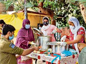 Food with dignity, an initiative by NGO, Hamari Udaan and ACT serves a meal for Rs.10 at Maya Enclave, Delhi to the underprivileged people. Food with dignity, an initiative by NGO, Hamari Udaan and ACT serves a meal for Rs.10 at Maya Enclave, Delhi to the underprivileged people.