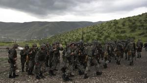 Soldiers leave a military area after a shooting practice at Mataghis army base.(AP) Soldiers leave a military area after a shooting practice at Mataghis army base.(AP)