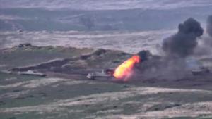A still image from a video released by the Armenian Defence Ministry shows what is said to be Azerbaijani armoured vehicles, one of which is destroyed by Armenian armed forces in the breakaway region of Nagorno-Karabakh.(via REUTERS) A still image from a video released by the Armenian Defence Ministry shows what is said to be Azerbaijani armoured vehicles, one of which is destroyed by Armenian armed forces in the breakaway region of Nagorno-Karabakh.(via REUTERS)
