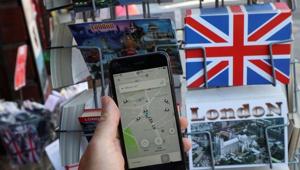 A photo illustration shows the Uber app and London themed postcards in London.(Reuters file) A photo illustration shows the Uber app and London themed postcards in London.(Reuters file)