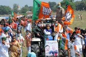 MP and BJP Kisan Morcha president Raj Kumar Chahar with senior party leaders from the city and workers taking out a tractor rally.(Keshav Singh/HT Photo) MP and BJP Kisan Morcha president Raj Kumar Chahar with senior party leaders from the city and workers taking out a tractor rally.(Keshav Singh/HT Photo)