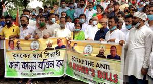 Congress supporters hold a banner and raise slogans as they protest against the new farm bills in Agartala on Monday.(ANI) Congress supporters hold a banner and raise slogans as they protest against the new farm bills in Agartala on Monday.(ANI)