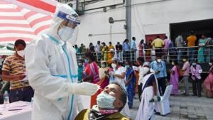A health worker takes samples for Covid-19 test, in Guwahati on Tuesday.(PTI) A health worker takes samples for Covid-19 test, in Guwahati on Tuesday.(PTI)