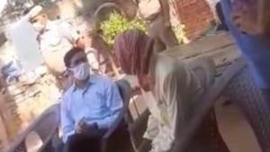 Hathras district magistrate Praveen Kumar visiting the family of the woman who died days after being raped and tortured in Delhi this week. (Videograb) Hathras district magistrate Praveen Kumar visiting the family of the woman who died days after being raped and tortured in Delhi this week. (Videograb)