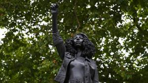 A sculpture by British artist Marc Quinn in collaboration with Bristol resident Jen Reid showing Jen Reid with an arm raised in a Black Power salute entitled ‘A Surge of Power (Jen Reid) 2020’, on the vacant Edward Colston statue plinth in Bristol, southwest England, on July 15. A sculpture of UK slave trader Edward Colston removed by anti-racism protesters in Bristol was replaced by that of the black woman who helped pull it down.(AFP file) A sculpture by British artist Marc Quinn in collaboration with Bristol resident Jen Reid showing Jen Reid with an arm raised in a Black Power salute entitled ‘A Surge of Power (Jen Reid) 2020’, on the vacant Edward Colston statue plinth in Bristol, southwest England, on July 15. A sculpture of UK slave trader Edward Colston removed by anti-racism protesters in Bristol was replaced by that of the black woman who helped pull it down.(AFP file)