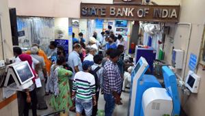People at a State Bank of India branch in New Delhi (Photo by Raj K Raj/ Hindustan Times) People at a State Bank of India branch in New Delhi (Photo by Raj K Raj/ Hindustan Times)
