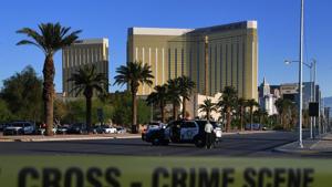 (FILES) In this file photo taken on October 2, 2017 crime scene tape surrounds the Mandalay Hotel (background) after a gunman opened fire on a country music concert in Las Vegas, Nevada.(AFP) (FILES) In this file photo taken on October 2, 2017 crime scene tape surrounds the Mandalay Hotel (background) after a gunman opened fire on a country music concert in Las Vegas, Nevada.(AFP)