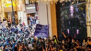 With some 6,000 riot police on standby, the display offered a marked contrast from a year ago, when calls for protests forced officials from the special administrative region to take shelter inside.(Bloomberg Photo) With some 6,000 riot police on standby, the display offered a marked contrast from a year ago, when calls for protests forced officials from the special administrative region to take shelter inside.(Bloomberg Photo)