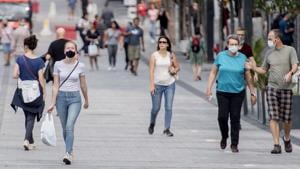 People walk along a street in Montreal, Canada.(AP) People walk along a street in Montreal, Canada.(AP)